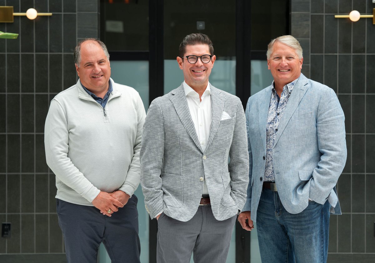 Three members of the Snapshot team standing together