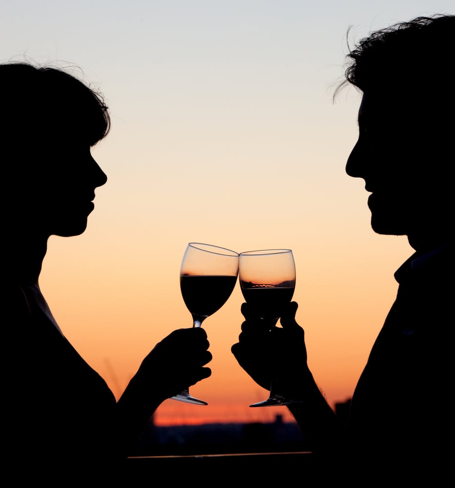 IWA Image of a couple toasting with wine by the sunset