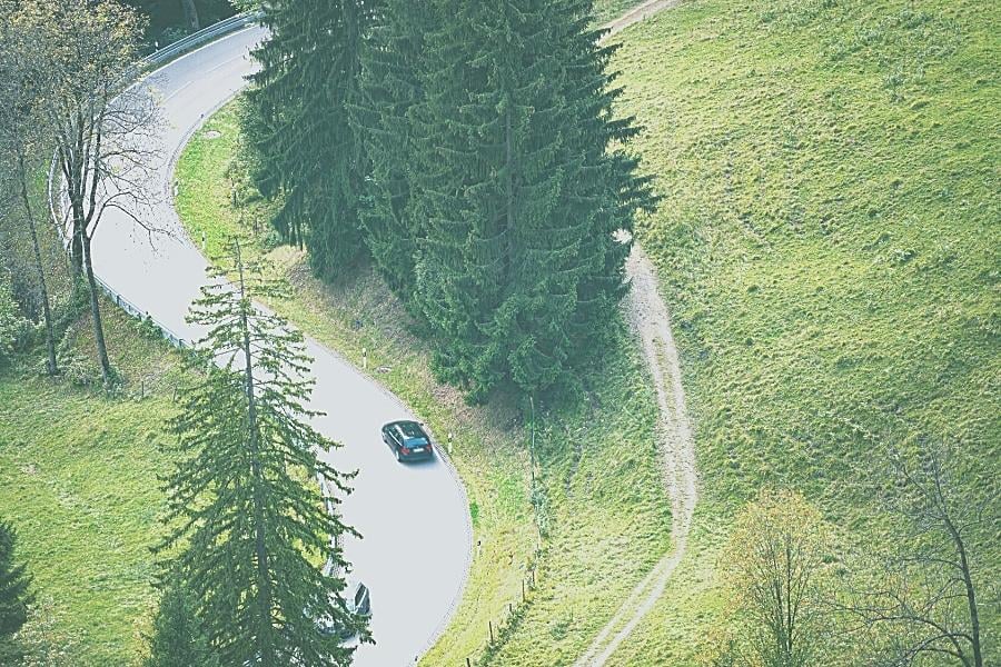 Drive Sales Image of car driving on curvy road