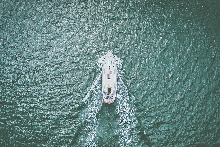 Image featuring an Aerial view of a boat in the ocean 