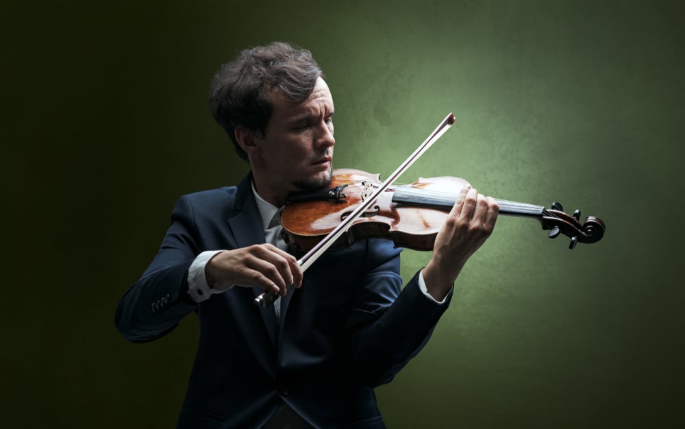 Shar Music Image of violinist composing on violin with nothing around